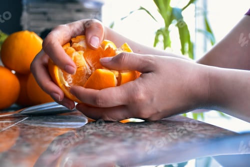 Preview: Peeling an orange to eat it