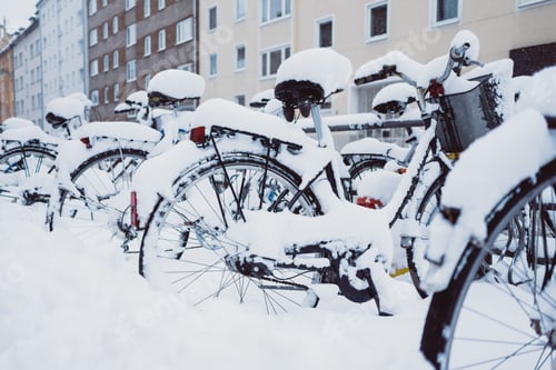 Preview: Bicycles in snow near houses