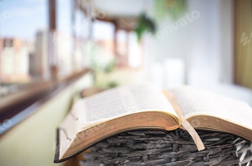 Preview: Book Bible close-up, on a beautiful terrace background. Morning time.
