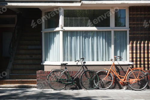 Preview: dutch bicycles parked in front of building