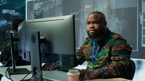 Preview: Army professionals in command post oversee satellite and real time surveillance