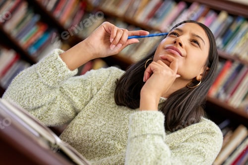 Preview: Go get it. Shot of a female thinking in a library.
