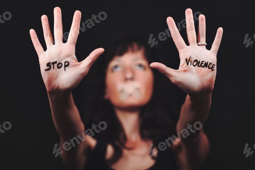 Preview: Woman Raises Hands With Stop Violence Message