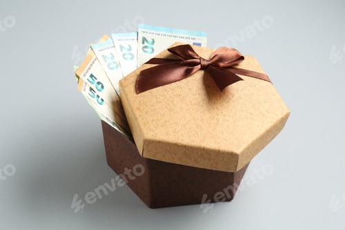 Preview: Money bonus. Gift box with euro banknotes on light grey background