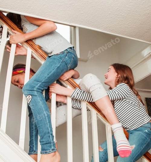 Preview: Kids playing on the staircase, full of laughter and adventure.