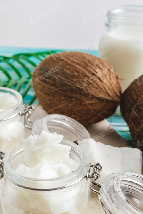 Preview: Coconut butter on wooden background. Organic healthy food concept