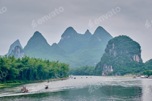 Preview: Tourist boats on Li river with carst mountains in the background