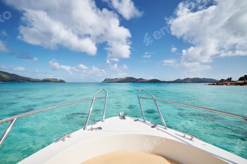 Preview: Bow of ship at sea with turquoise water between tropical islands. Praslin Island, Seychelles.