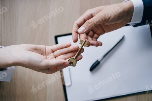 Preview: house key in hand for sale real estate agent
