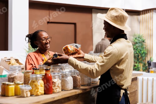 Preview: Woman discusses with friendly shopkeeper