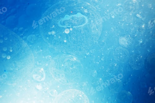 Preview: Oil bubbles close up. circles of water macro. abstract light blue background