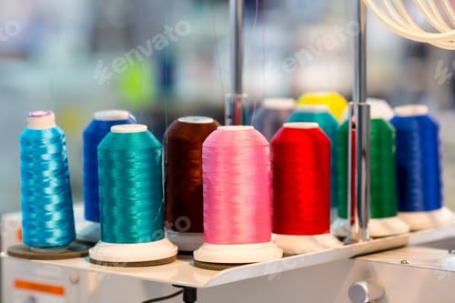 Preview: Spools of color threads closeup, sewing material