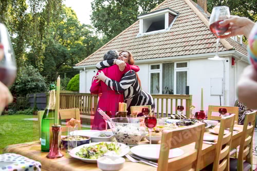 Preview: Friends and family arriving at a summer garden party