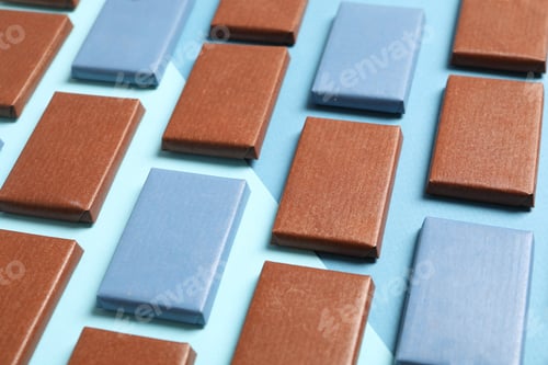 Preview: Blue and brown chocolate bars on a blue background