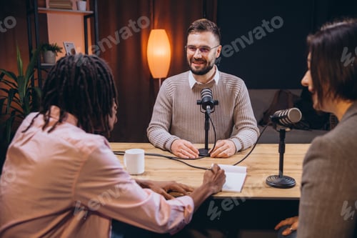 Preview: Diverse podcasters recording audio content in a home studio, using microphones and notepad