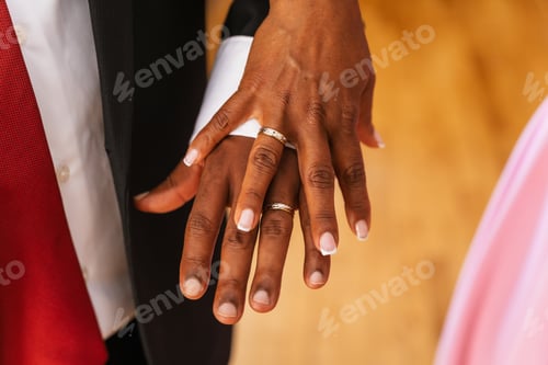 Preview: Black ethnic couple embracing with ring at a beautiful wedding, marriage ceremony