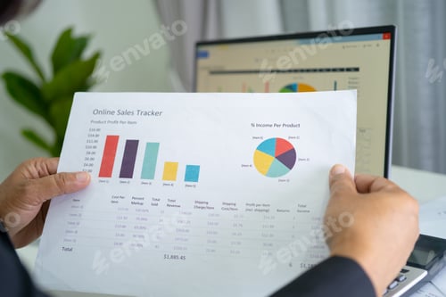 Preview: Asian accountant working and analyzing financial reports project accounting with chart graph