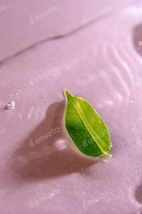 Preview: A drop of transparent cosmetic gel on a pink background