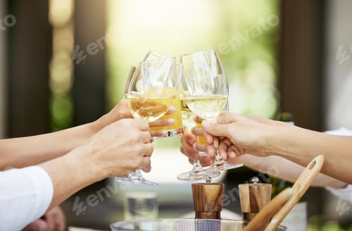 Preview: Let the good times roll. Cropped shot of a group of people sharing a toast around the dining table.