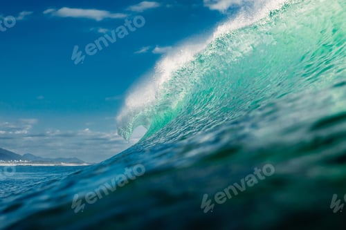 Preview: Breaking swell wave and coastal landscape