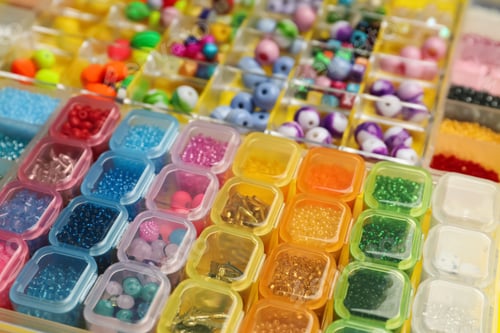 Preview: Organizers with variety of colorful beads as background