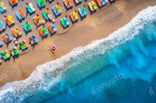 Preview: Aerial view of lying woman with swim ring in the sea in Oludeniz