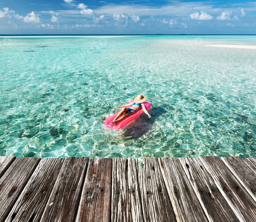 Preview: Woman Relaxing On Inflatable Mattress At The Beach