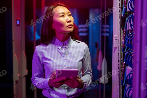 Preview: Pensive IT Specialist Checking Cables