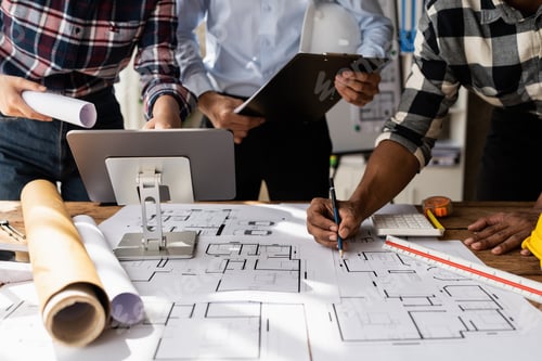 Preview: Architect team working with blueprints for architectural plan, engineer sketching a construction