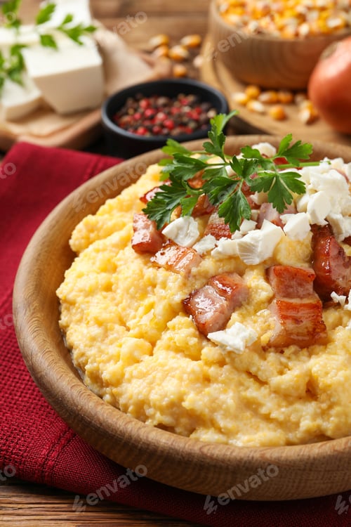 Preview: Delicious traditional Ukrainian banosh served on wooden table, closeup