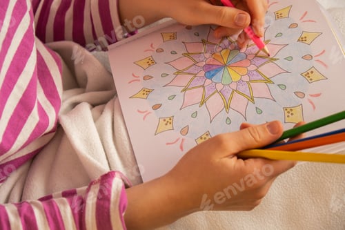 Preview: Female painting mandalas antistress page to combat stress. Relaxing hobby mental wellbeing and art