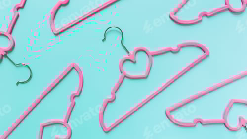 Preview: Pink Clothes Hangers on a Turquoise Background