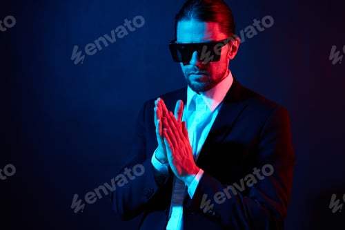 Preview: portrait of a man modern style suit fashion sunglasses dark background
