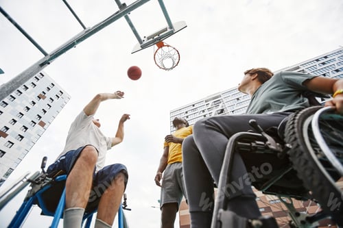 Preview: People playing basketball outdoors