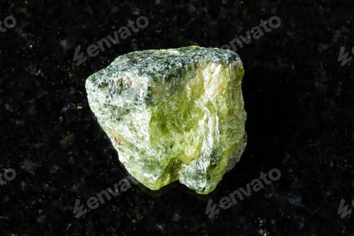 Preview: sample of rough green sphene mineral on black
