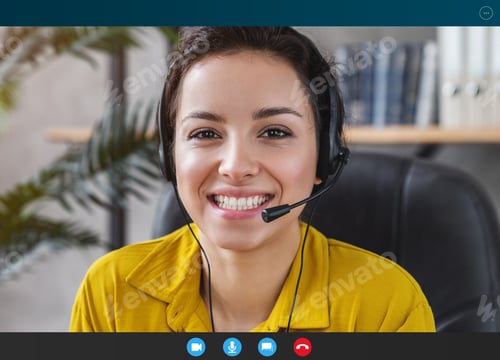 Preview: Smiling young caucasian woman with headset and microphone indoor