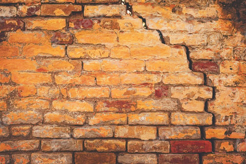 Preview: Damaged cracked old brick wall structure, due to structural foundation failure and deterioration