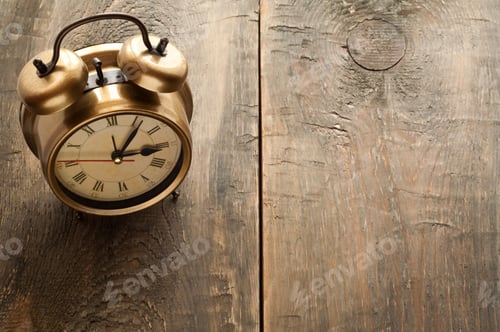 Preview: Retro alarm clock on a wooden table