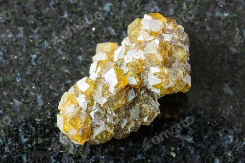 Preview: rough druse of andradite garnet crystals on black