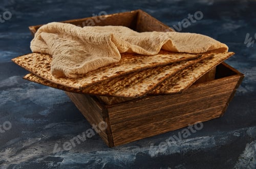 Preview: Passover celebration concept - Jewish holiday Passover. A stack of matzos on blue marble with a