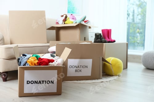 Preview: Carton boxes with donations in living room