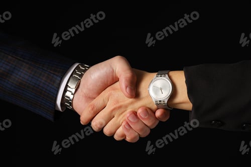 Preview: Male handshake close-up on a dark background