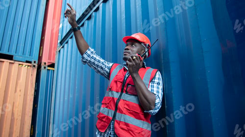 Preview: Foreman control Shipping container site loading in logistic port warehouse storage factory.