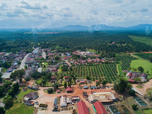 Preview: Aerial drone view of a small town near oil palm plantations land in Asahan, Melaka, Malaysia.