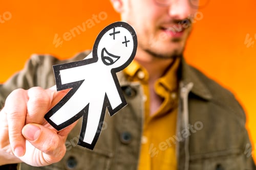 Preview: Smiling man holding funny paper toy