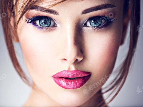 Preview: Attractive young woman with beautiful big blue eyes.
