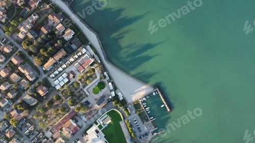 Preview: Top view of a residential neighborhood by the sea captured during the daytime