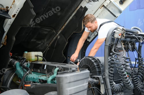 Preview: Man in uniform. Truck repair. Car malfunction