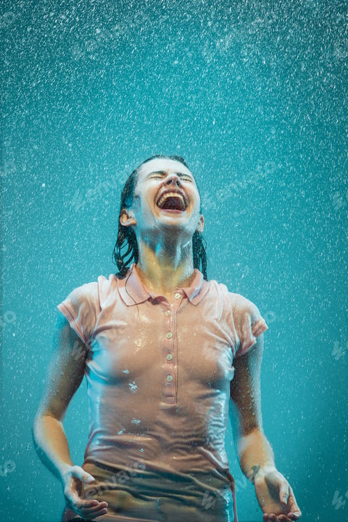 Preview: The portrait of young beautiful woman in the rain