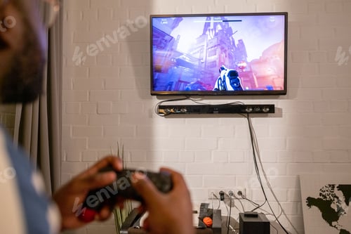 Preview: Gamer playing online game at home